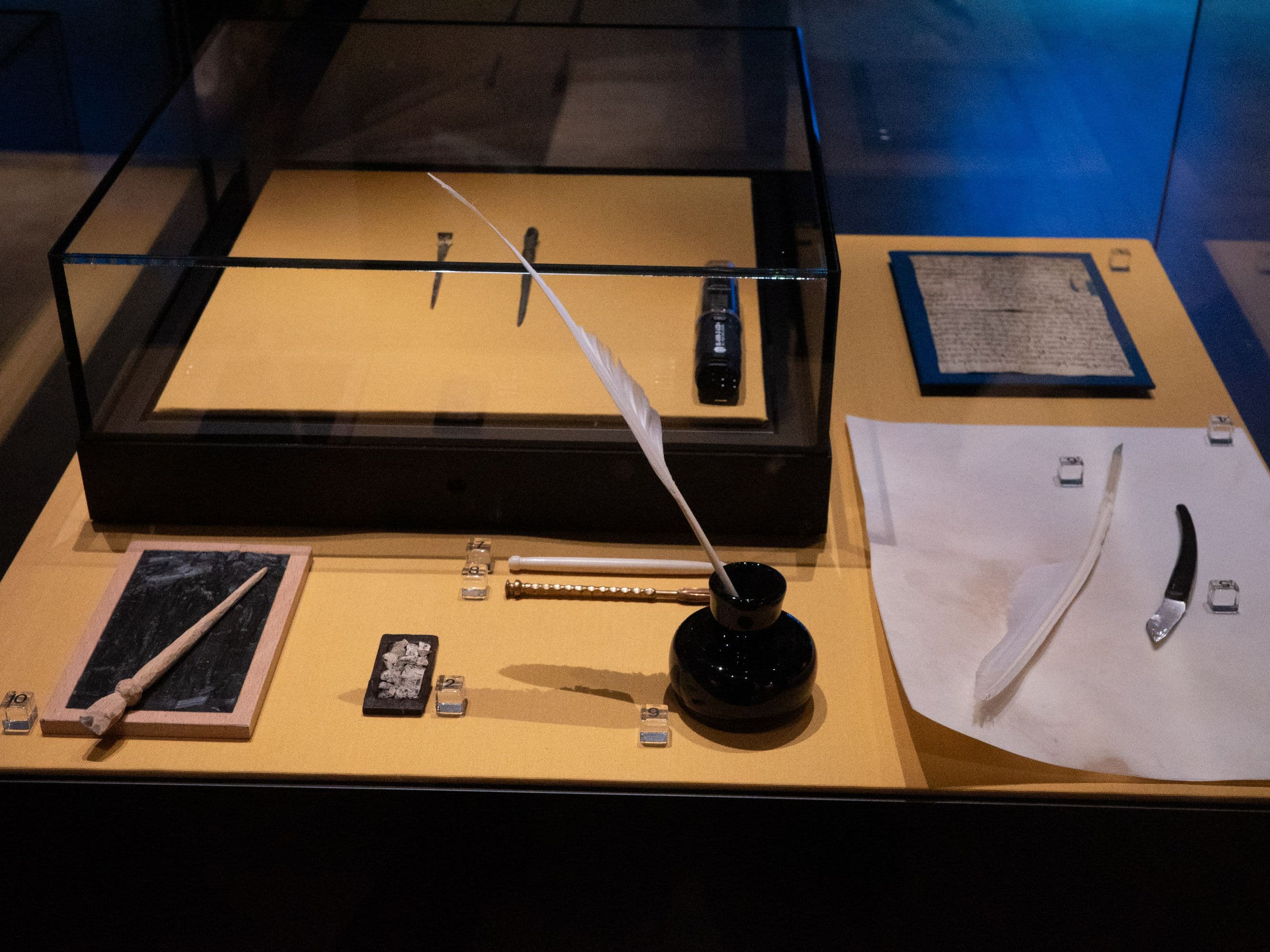 An exhibition showcase with objects that were used for book production in the past.