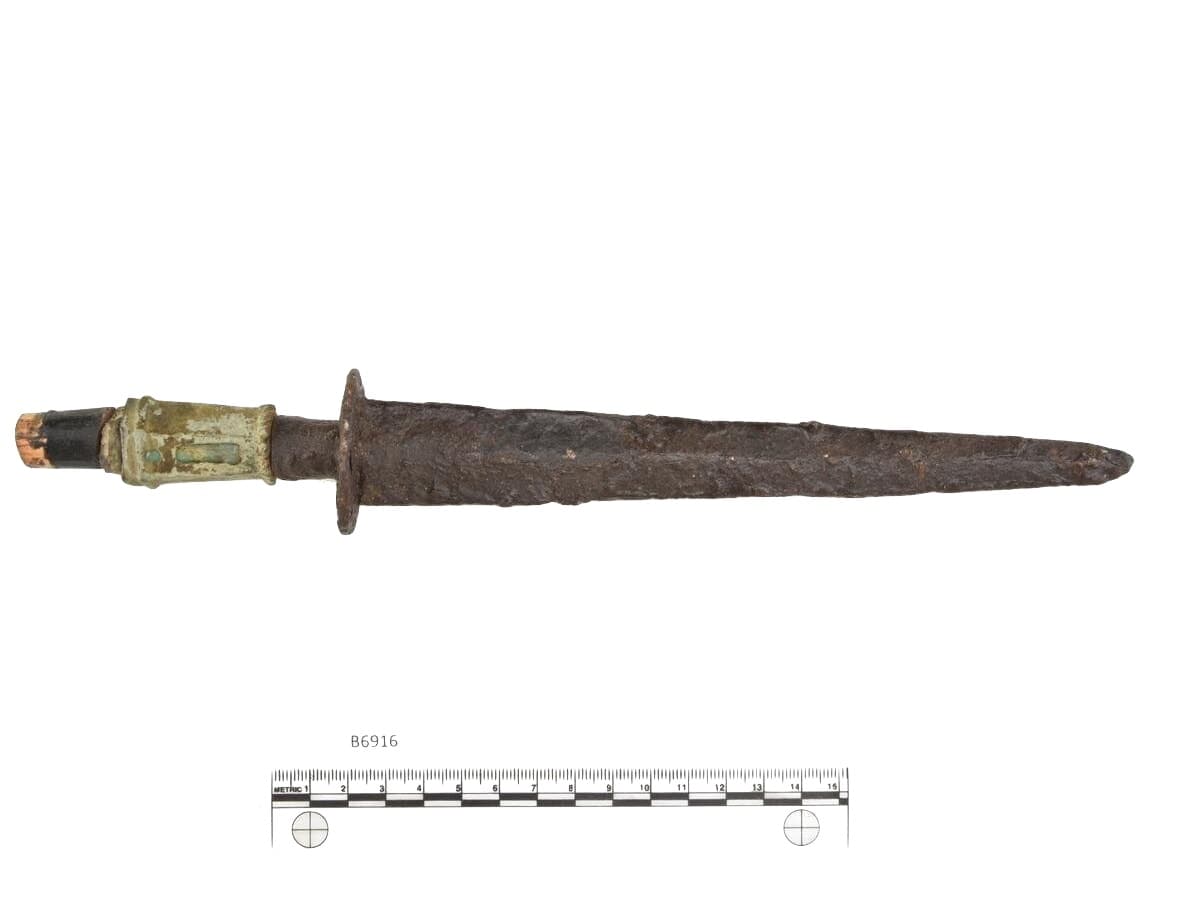 Rondel dagger with handle of copper alloy, bone and wood, from Eikenes, Stryn.