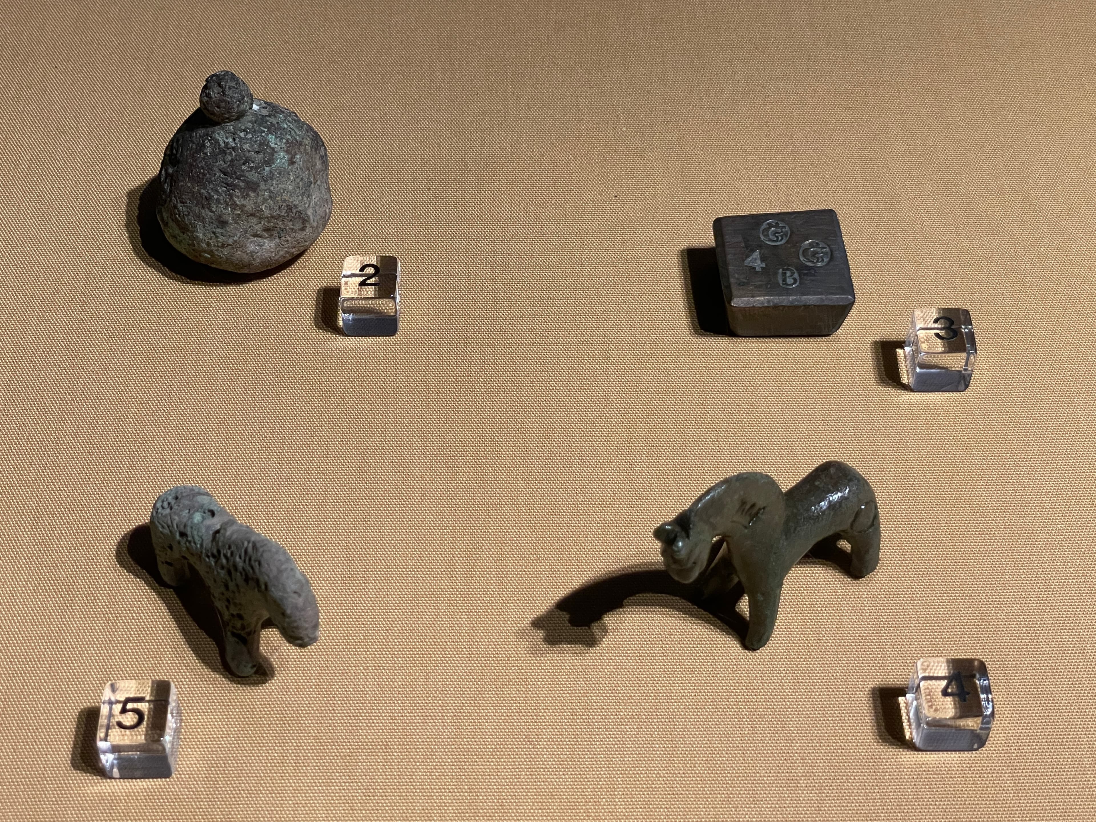 Various weights from an exhibition showcase.