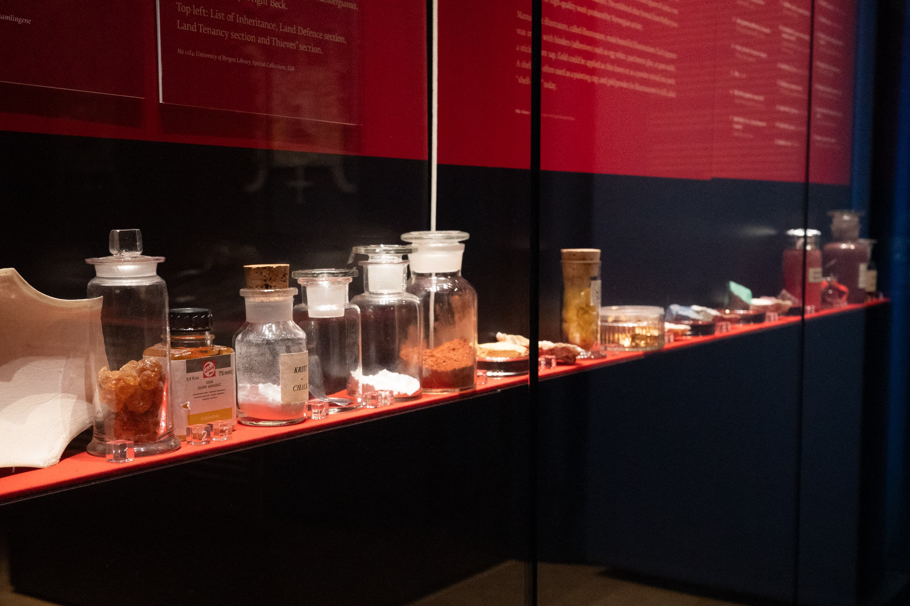 Containers with the elements that were used to make colours in the Middle Ages, in an exhibition showcase